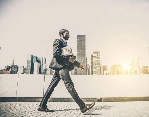 Confident masculine man walking with purpose in the morning light